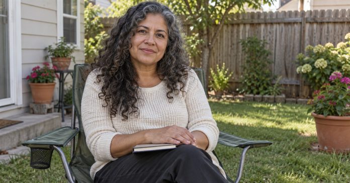 3044 Guardian angel reflection in an ordinary yard Woman sitting in a folding garden chair with a notebook in a modest backyard